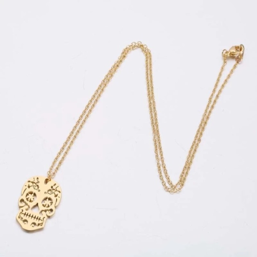 Yellow gold skull necklace